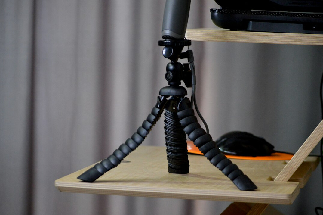 Camera mounted on a tripod ready for filming