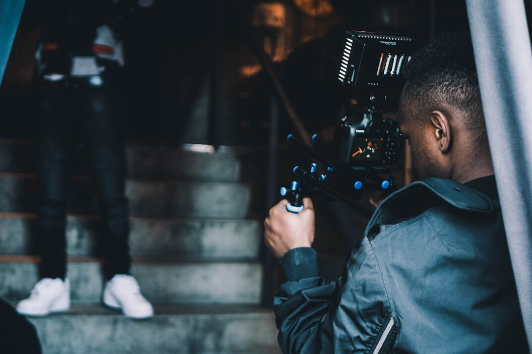 cinematographer adjusting lights