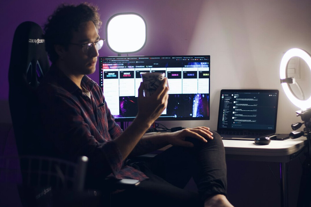 person editing video at desk